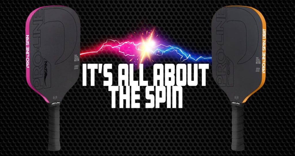 Two Pro-Line Spin pickleball paddles on a black honeycomb background, one with pink accents (left) and the other with orange accents (right), connected by a central lightning effect of pink and blue energy. Bold white text in the middle reads: ‘IT’S ALL ABOUT THE SPIN.